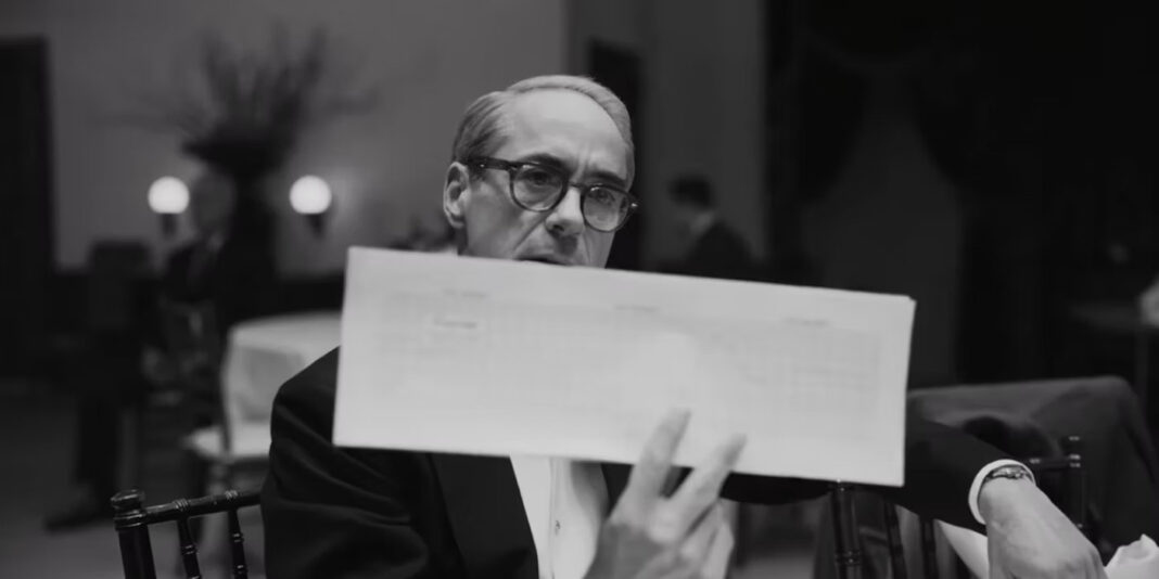 robert-downey-jr-as-lewis-strauss-holding-up-a-piece-of-paper-in-oppenheimer