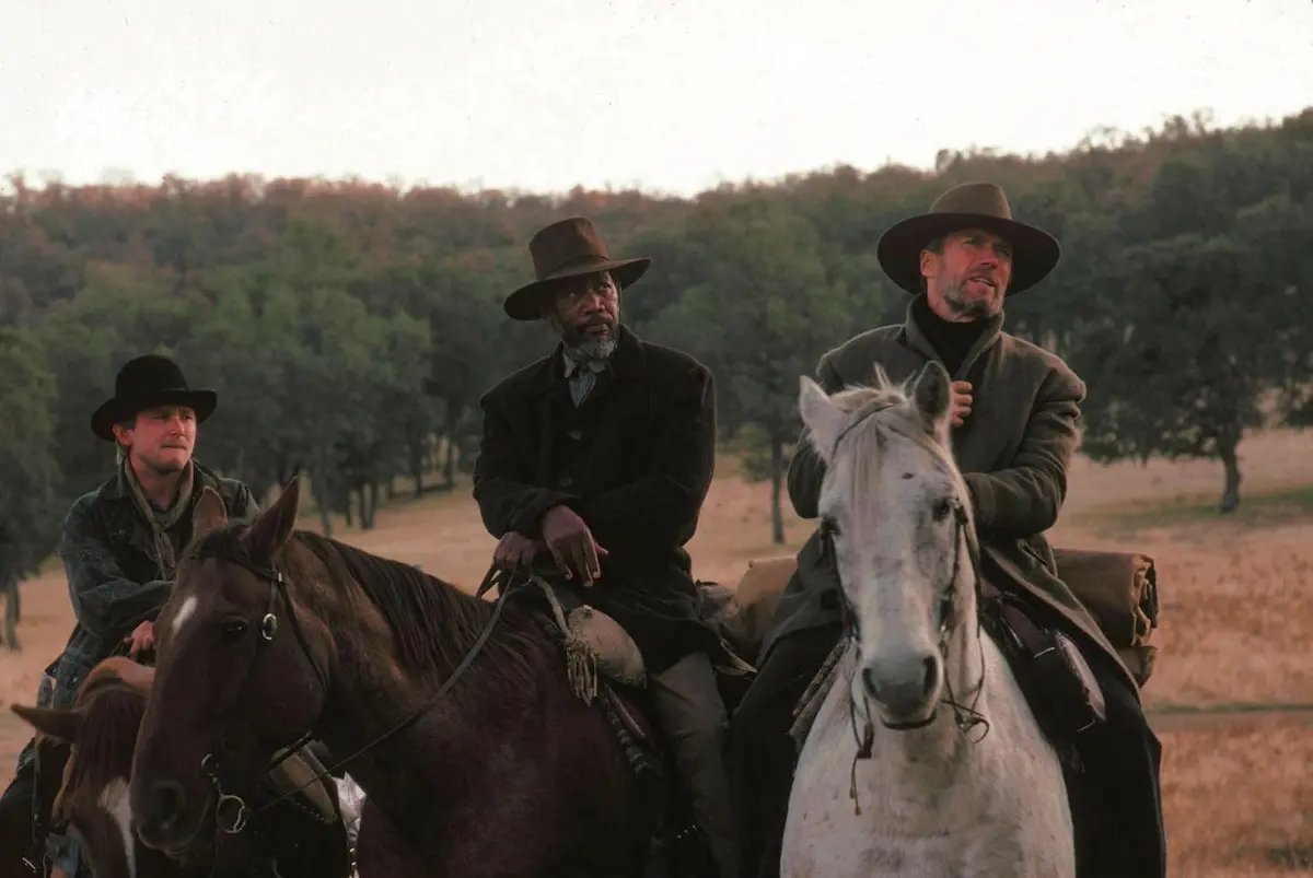 Clint Eastwood, Morgan Freeman, and Jaimz Woolvett in Gli spietati (1992)