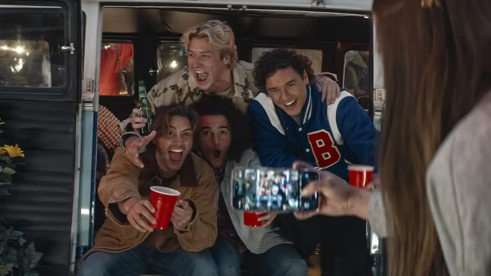 Logan, Dean, Tucker, and Garrett pose for a photo at a party in Off Campus